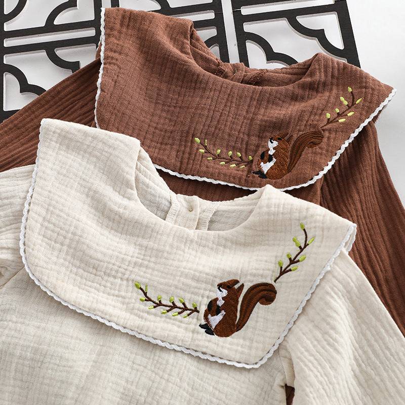 Baby girl onesie featuring animal embroidery and lapel design in beige and coffee colors.