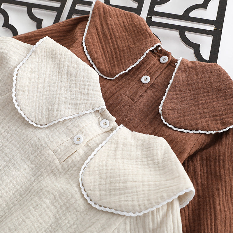 Baby girl onesie featuring animal embroidery and lapel design in beige and coffee colors.