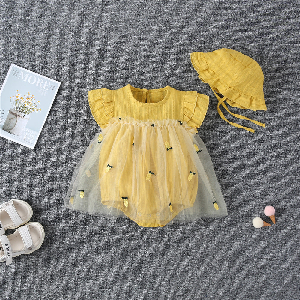 Baby girl dress featuring pineapple embroidery and mesh overlay, perfect for summer occasions.