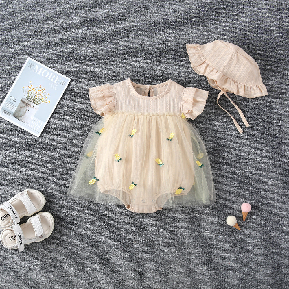 Baby girl dress featuring pineapple embroidery and mesh overlay, perfect for summer occasions.