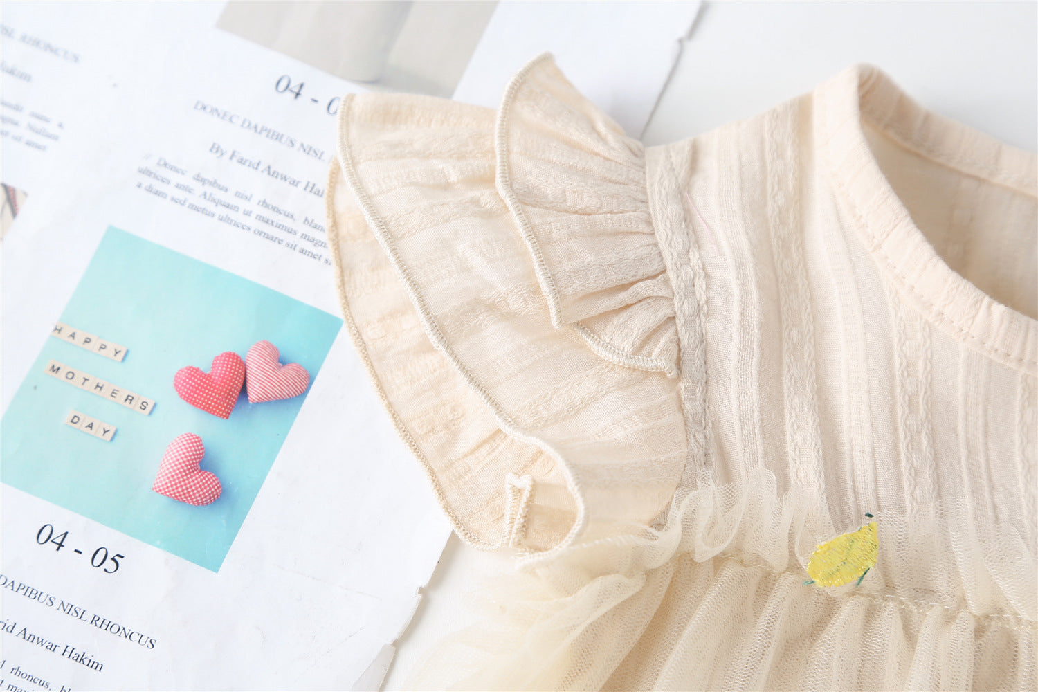 Baby girl dress featuring pineapple embroidery and mesh overlay, perfect for summer occasions.