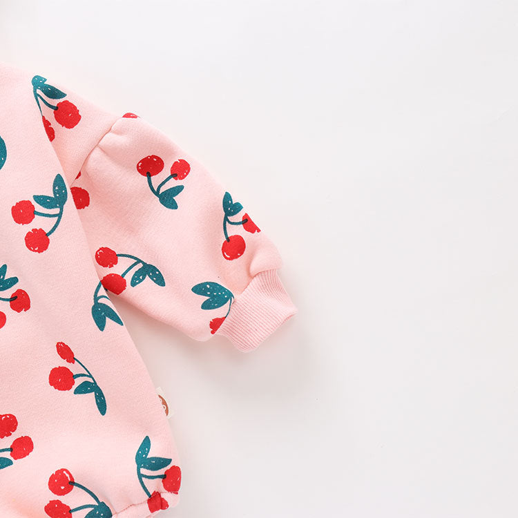 Baby girl bodysuit featuring an allover cherry pattern with lantern sleeves in pink cotton fabric.