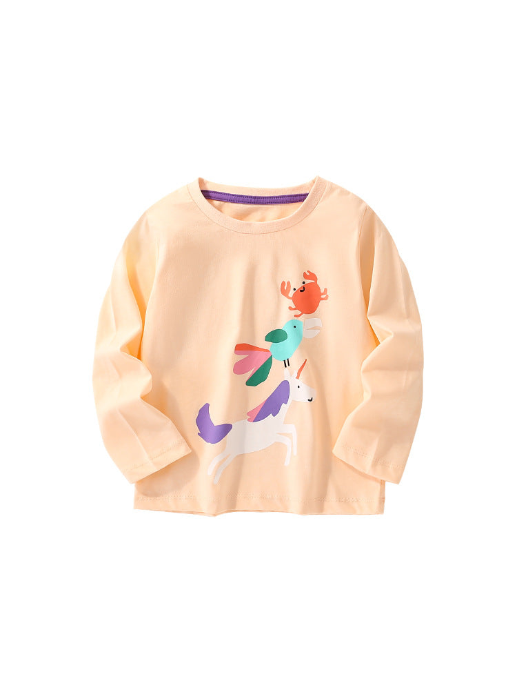 Baby girl wearing a colorful cartoon pattern crewneck shirt, showcasing vibrant colors and playful designs.