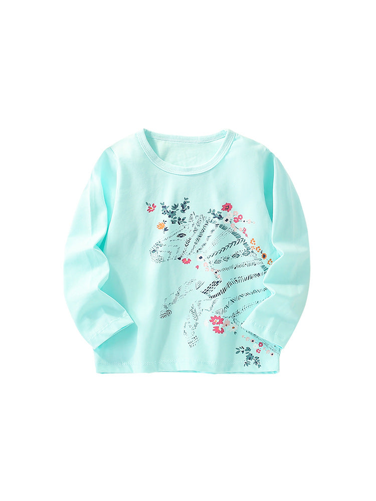 Baby girl wearing a colorful cartoon pattern crewneck shirt, showcasing vibrant colors and playful designs.