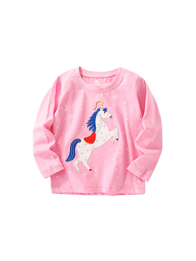 Baby girl wearing a colorful cartoon pattern crewneck shirt, showcasing vibrant colors and playful designs.