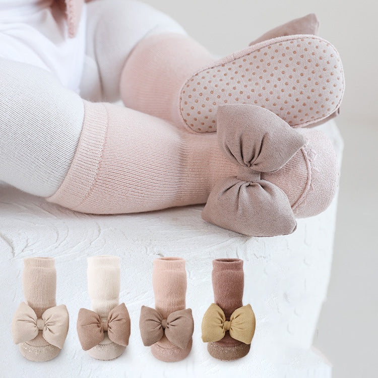 Baby Girl Big Bows Design Non-Slip Mid Tube Shoes in white, pink, beige, and brown colors, showcasing a stylish and comfortable design.