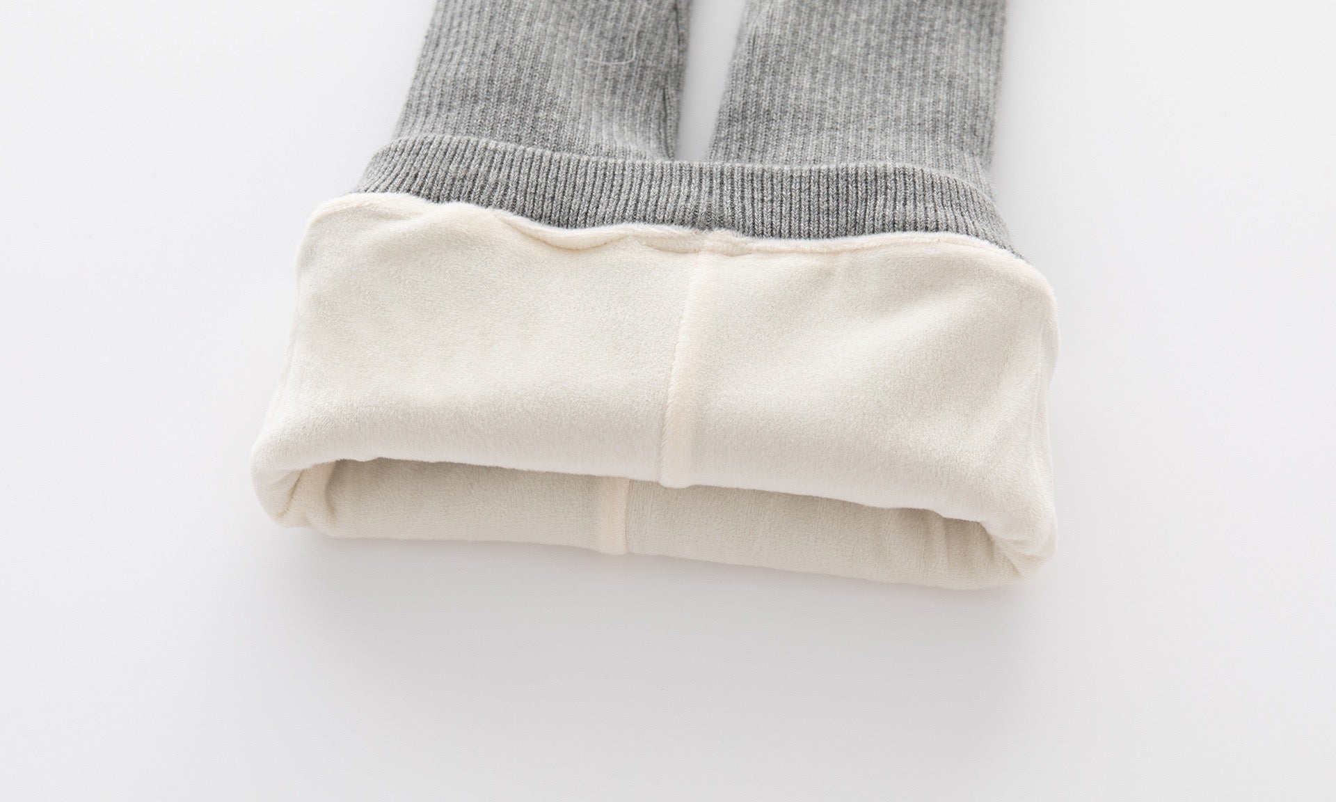 Baby girl comfy pants with bow tie patch design in white and grey colors, made from soft cotton material.