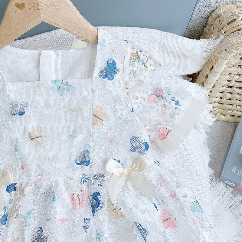 A beautiful baby girl dress featuring a butterfly print and lace patchwork design with a square collar, perfect for summer occasions.