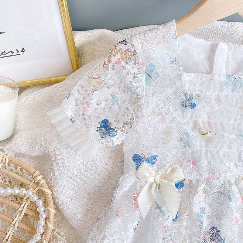 A beautiful baby girl dress featuring a butterfly print and lace patchwork design with a square collar, perfect for summer occasions.