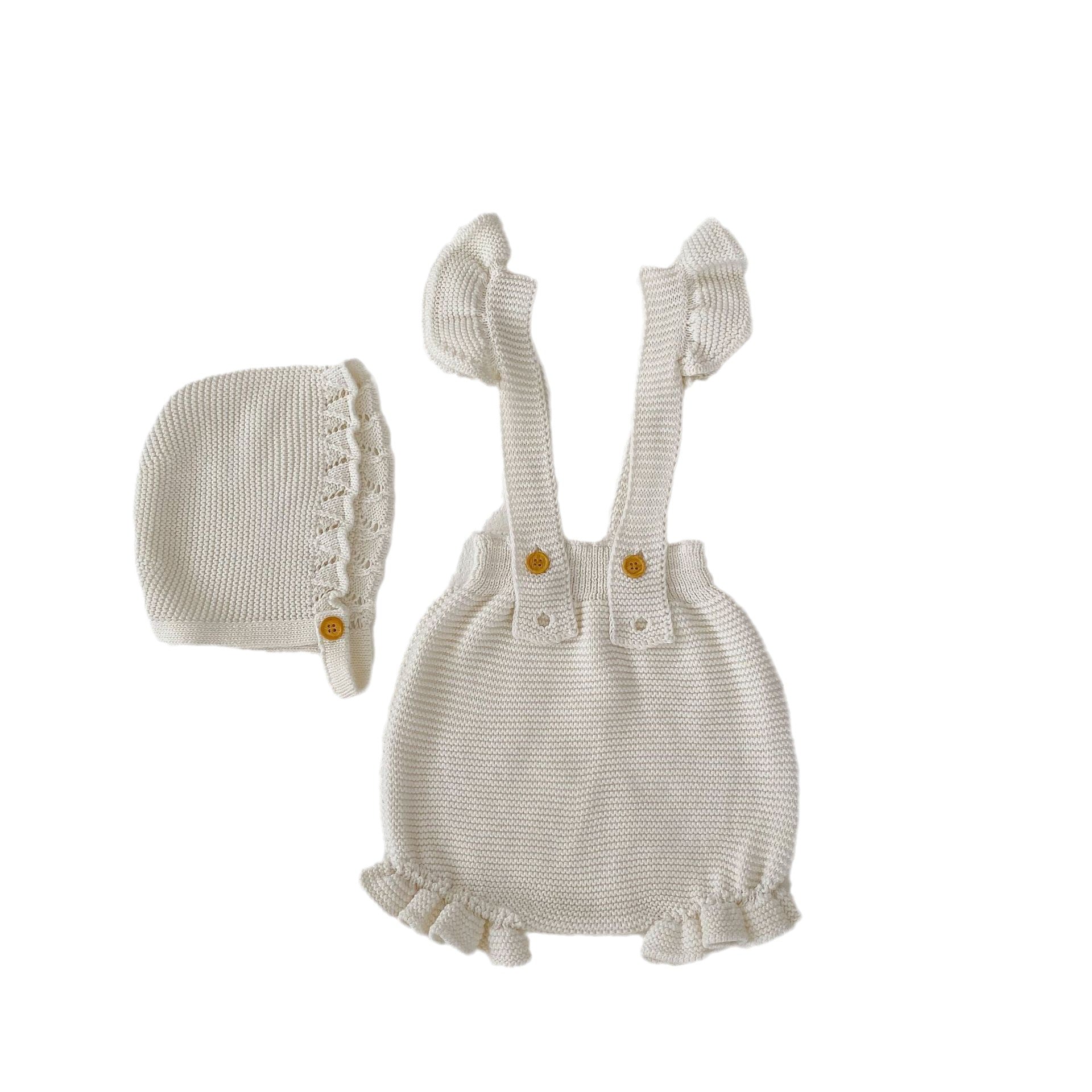 Baby girl wearing a white knitted camisole vest with a matching cap, perfect for spring and autumn.