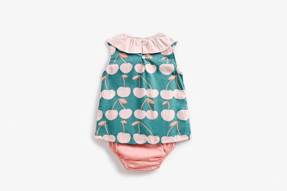 Baby girl wearing a cherry print ruffle design O-neck top and shorts set, perfect for summer outings.