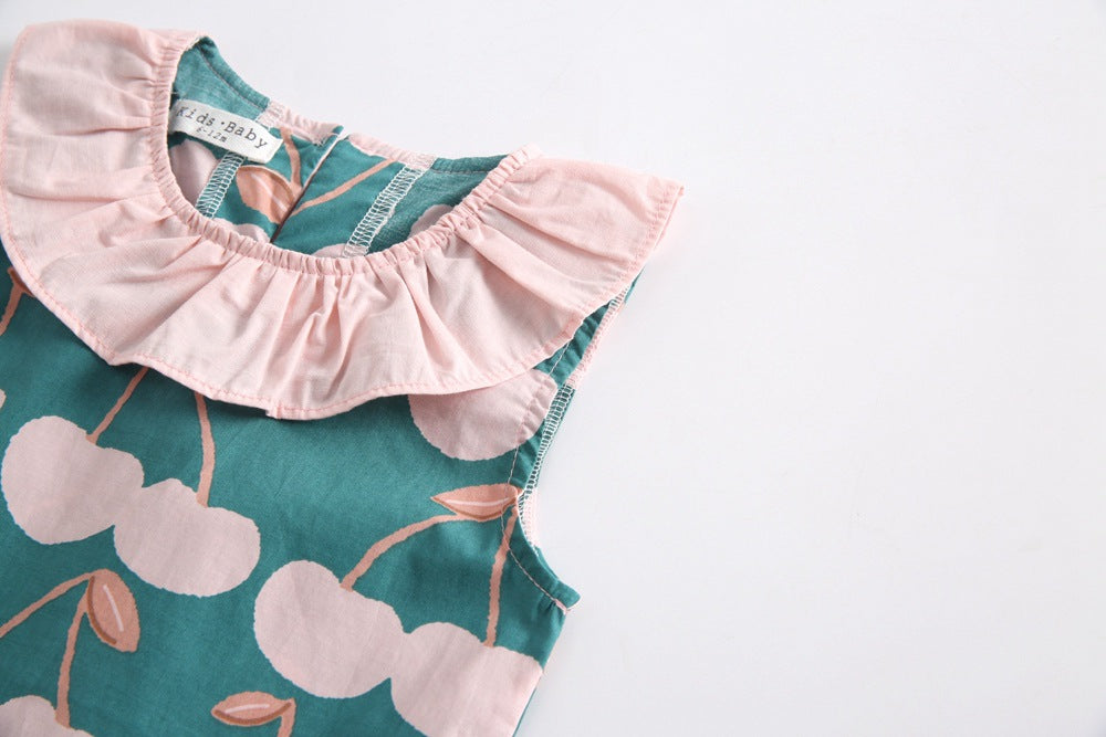 Baby girl wearing a cherry print ruffle design O-neck top and shorts set, perfect for summer outings.