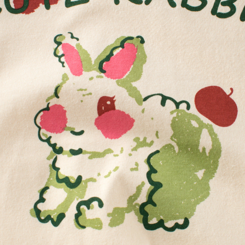 A pink baby girl shirt featuring a cute bunny print and colorblock design, made from soft cotton fabric.