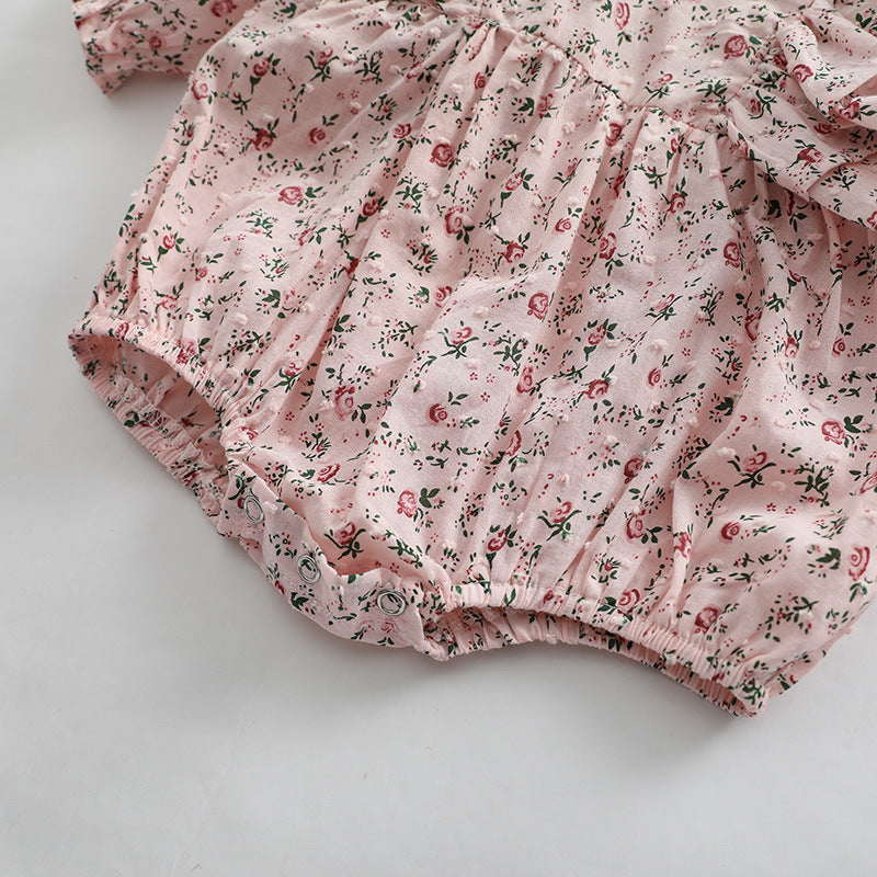 Baby girl long sleeve bodysuit featuring a ditsy flower pattern in soft pink, perfect for spring and autumn wear.