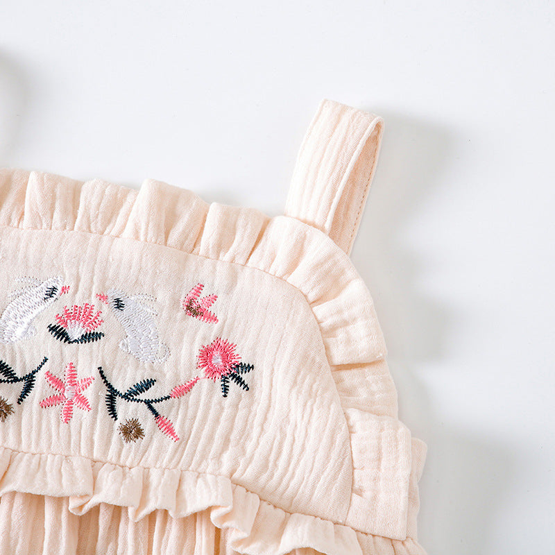 Baby girl wearing a floral embroidered sleeveless onesie in pink, showcasing lace design and solid color, perfect for summer.