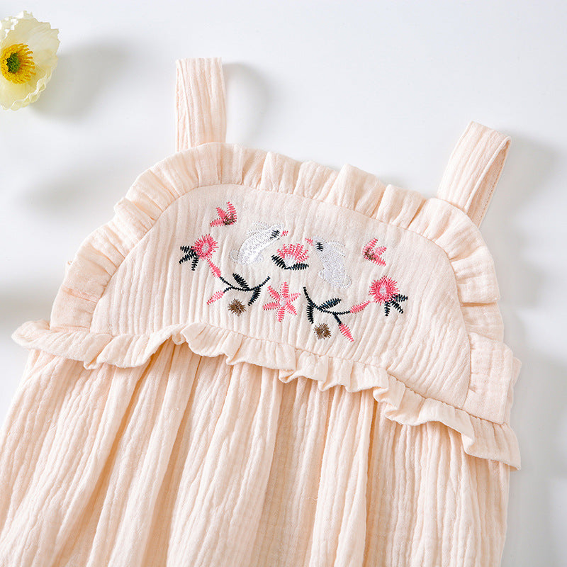 Baby girl wearing a floral embroidered sleeveless onesie in pink, showcasing lace design and solid color, perfect for summer.