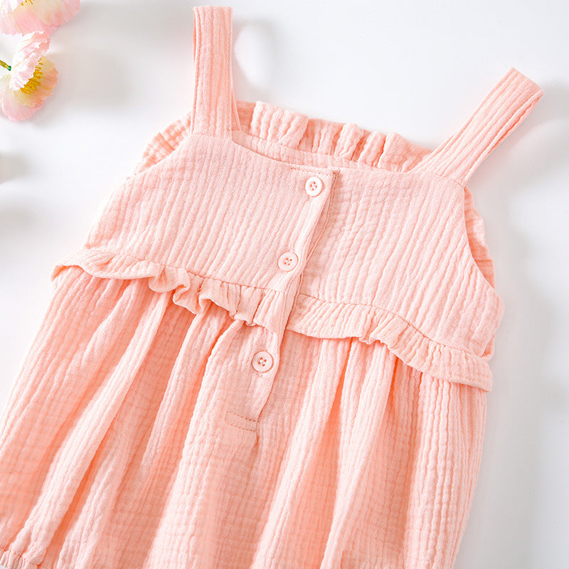 Baby girl wearing a floral embroidered sleeveless onesie in pink, showcasing lace design and solid color, perfect for summer.