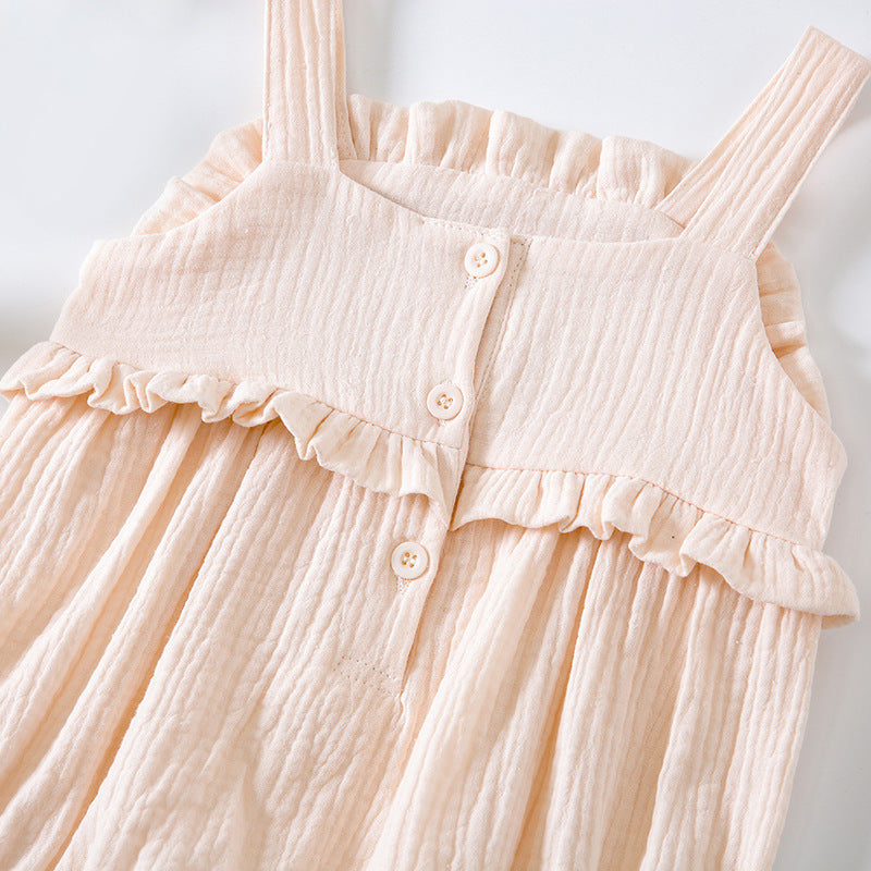 Baby girl wearing a floral embroidered sleeveless onesie in pink, showcasing lace design and solid color, perfect for summer.