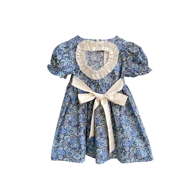 A beautiful baby girl dress featuring floral embroidery and lace patchwork, designed with puff sleeves and a backless silhouette in blue.