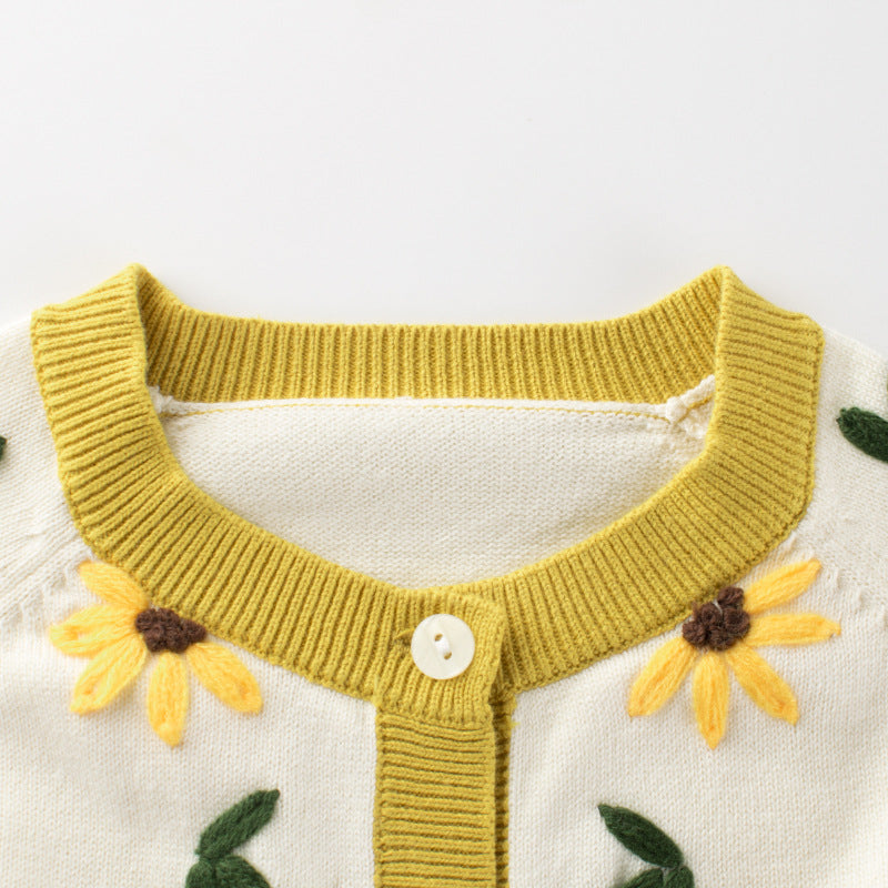 Baby girl knitwear featuring floral embroidery and colorblock design in vibrant yellow, perfect for spring and autumn.