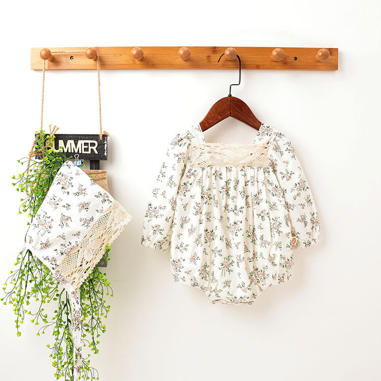 Baby girl outfit featuring floral pattern, lace patchwork, backless design, and bubble sleeves in white and beige colors.