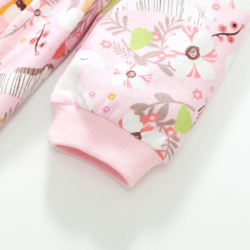 Baby girl wearing a pink floral pattern long sleeves hoodie dress, showcasing its soft cotton fabric and charming design.