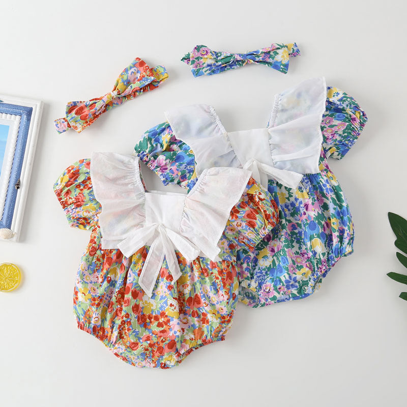 Baby girl onesie featuring a floral pattern, white bow patchwork, and square neckline, perfect for summer wear.