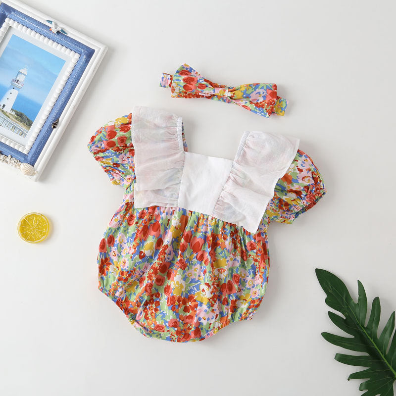 Baby girl onesie featuring a floral pattern, white bow patchwork, and square neckline, perfect for summer wear.