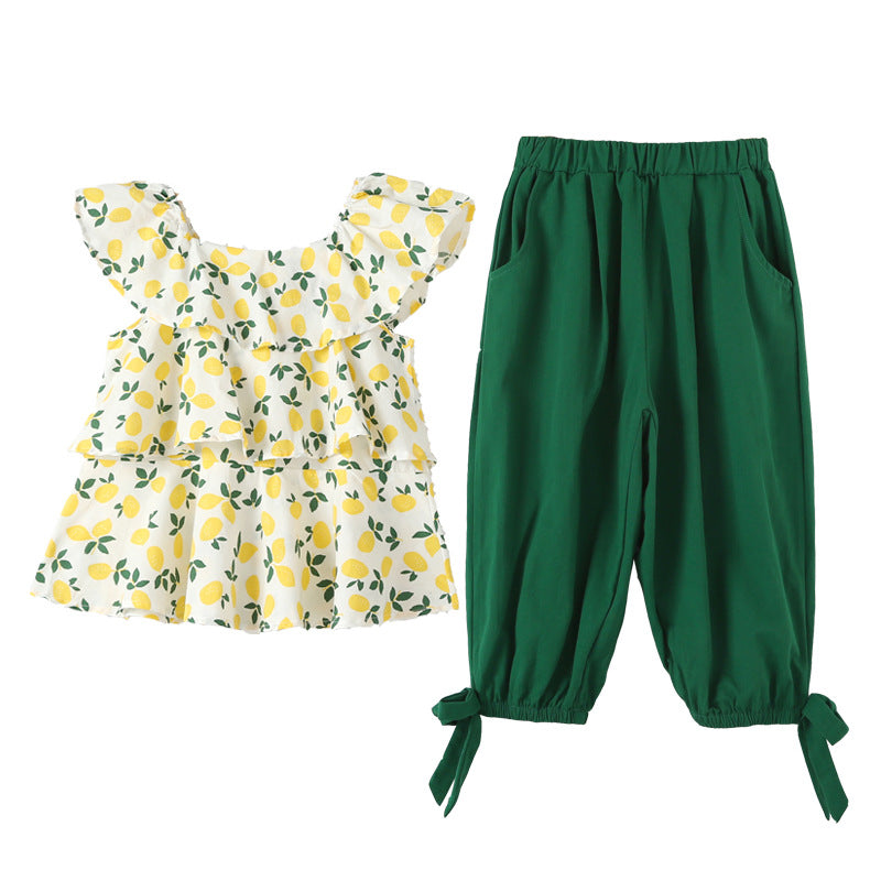 A stylish baby girl outfit featuring a floral print lace design top and solid green pants, perfect for summer occasions.