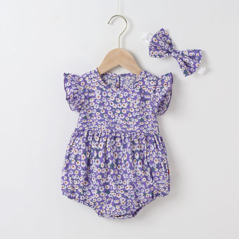 Baby girl wearing a floral print onesie with a matching headband, perfect for summer outings.