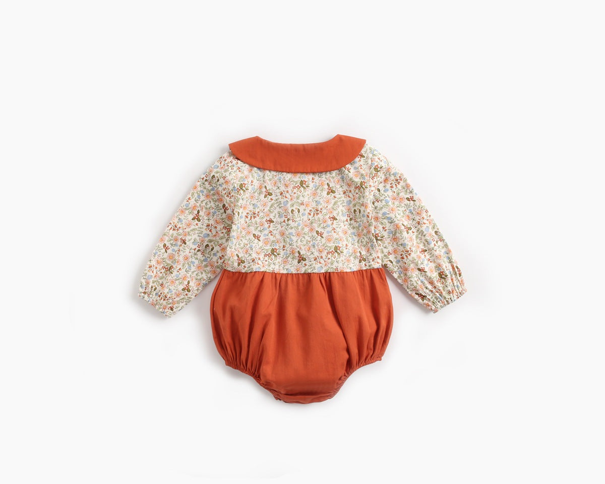 Baby girl long sleeve onesie with floral print and color blocking design in red and yellow, perfect for spring and summer.