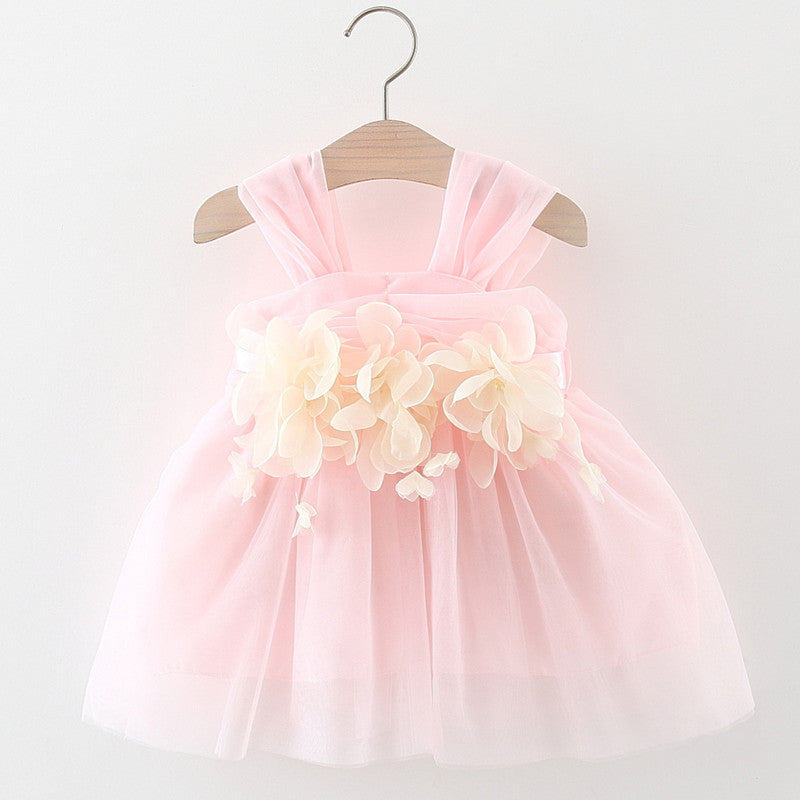 A beautiful baby girl wearing a flower patched design mesh princess formal dress in pink, showcasing delicate floral details and an elegant style.