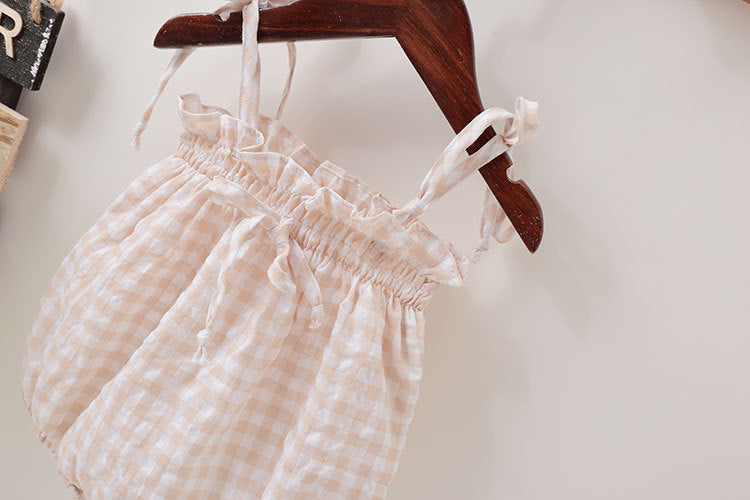 Baby girl sleeveless onesie featuring a fresh plaid pattern and a stylish bow tie design, perfect for summer wear.