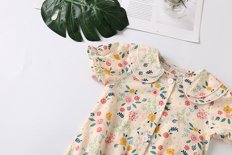 A stylish baby girl shirt featuring a floral print and double collar design, perfect for summer wear.