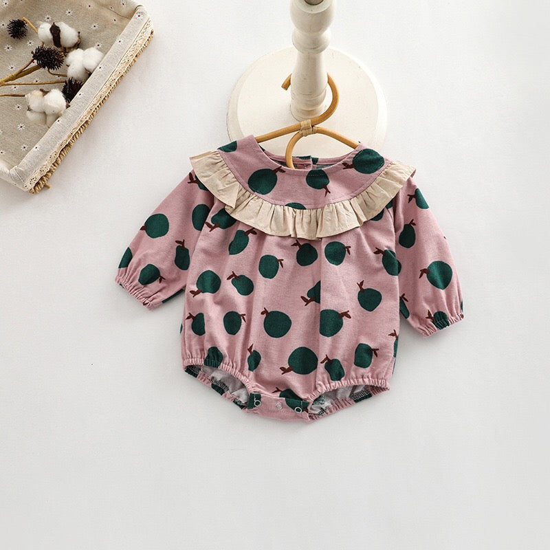 Baby girl long sleeve onesies featuring a vibrant fruit orange patchwork design in pink, green, and yellow colors.