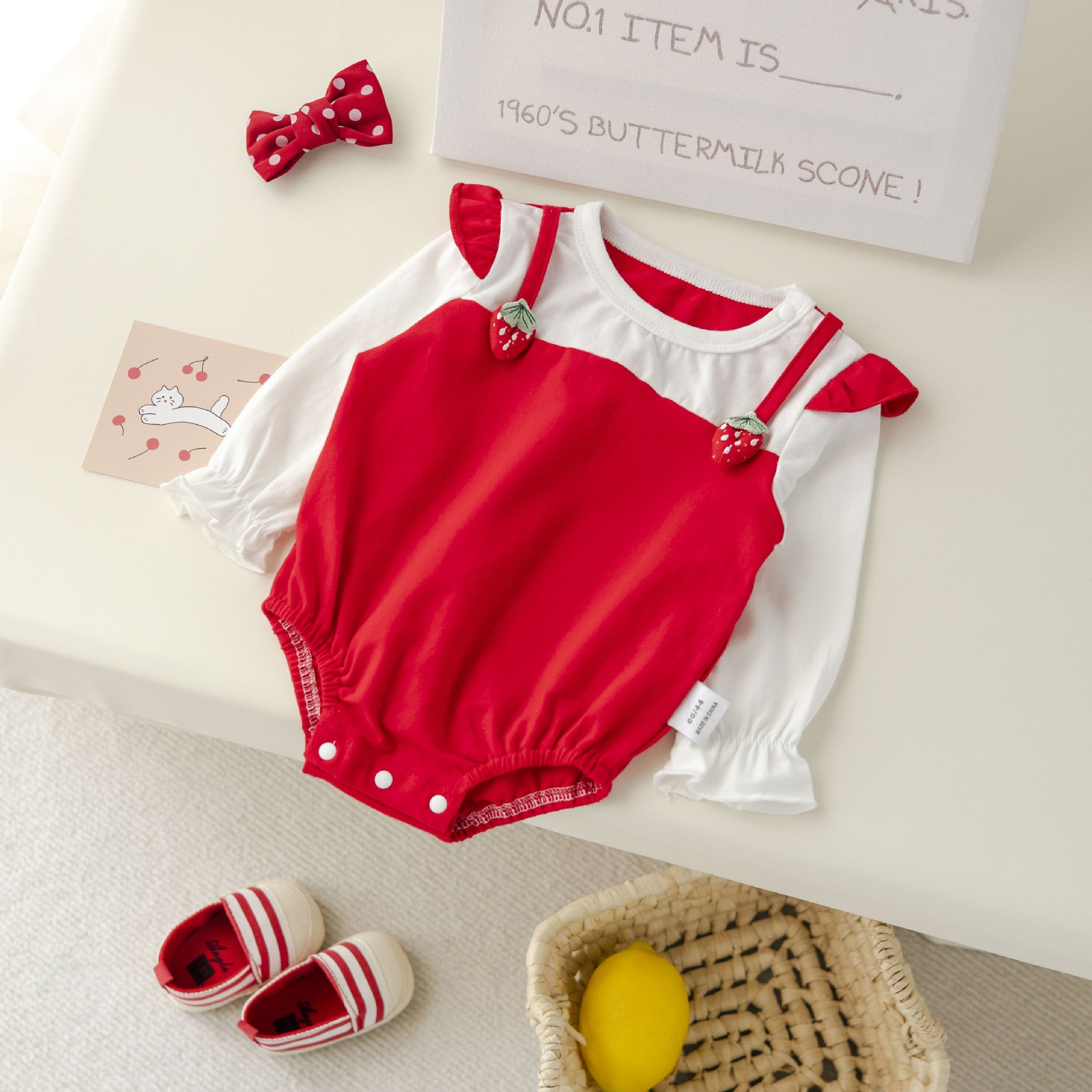 Baby girl bodysuit with fruit patches in vibrant colors, perfect for spring and autumn.