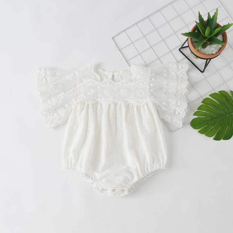 Baby girl lace-sleeved onesie in white and apricot colors, featuring delicate lace sleeves and collar, perfect for summer occasions.