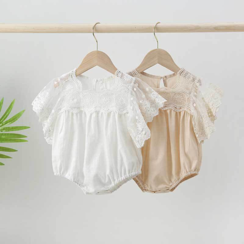 Baby girl lace-sleeved onesie in white and apricot colors, featuring delicate lace sleeves and collar, perfect for summer occasions.