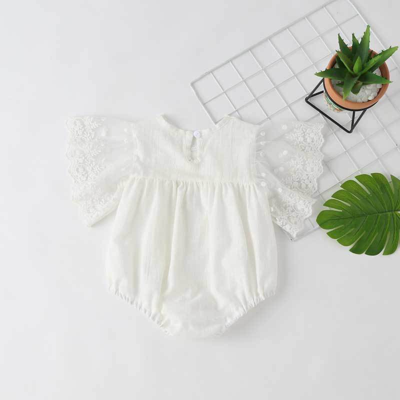 Baby girl lace-sleeved onesie in white and apricot colors, featuring delicate lace sleeves and collar, perfect for summer occasions.