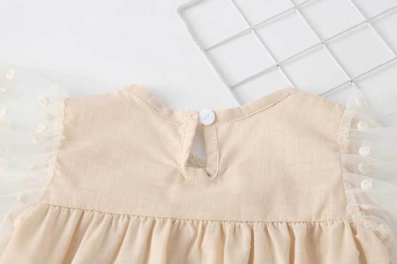 Baby girl lace-sleeved onesie in white and apricot colors, featuring delicate lace sleeves and collar, perfect for summer occasions.