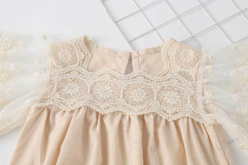 Baby girl lace-sleeved onesie in white and apricot colors, featuring delicate lace sleeves and collar, perfect for summer occasions.