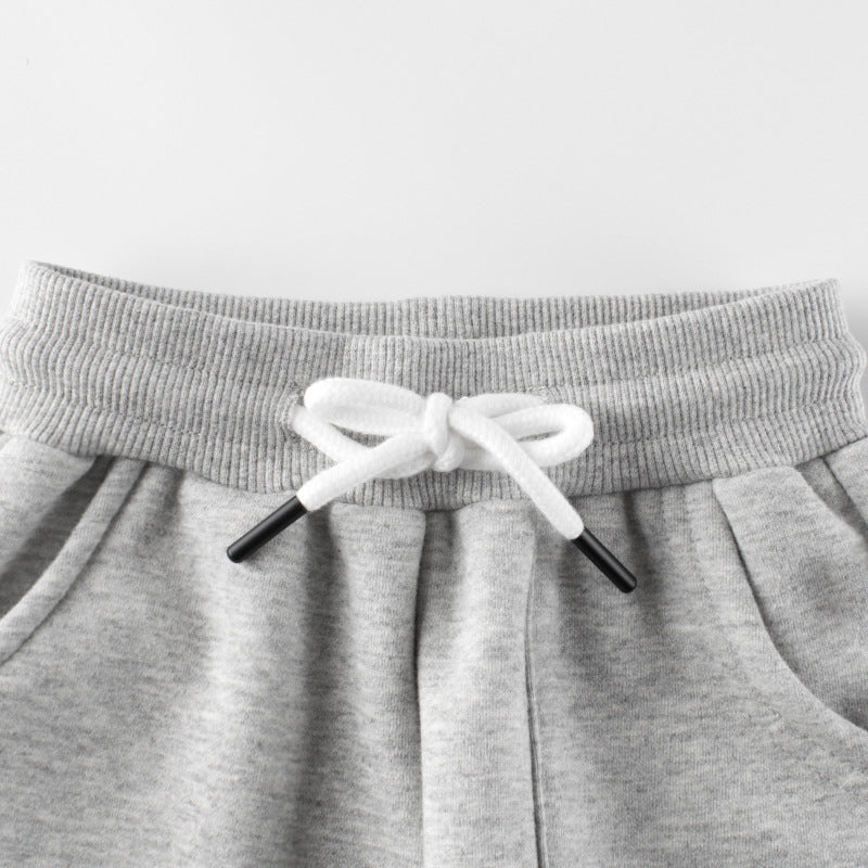 Baby girl fleece trousers in black and grey with 'Baby Girl' graphic, perfect for cozy wear.