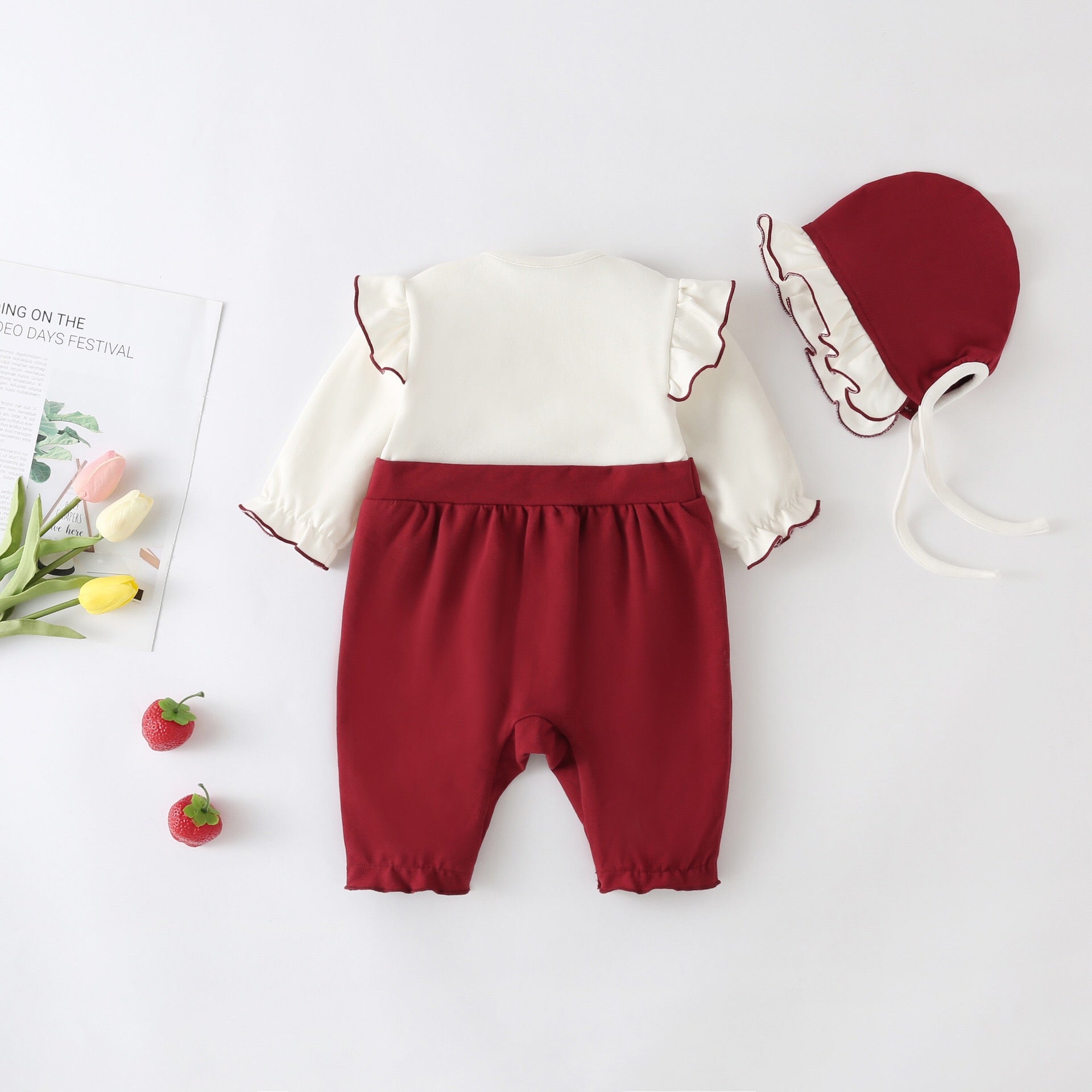 A stylish Baby Girl Lettuce Trim Design Big Bow Long Sleeve Jumpsuit in vibrant red, featuring a chic big bow and playful lettuce trim.