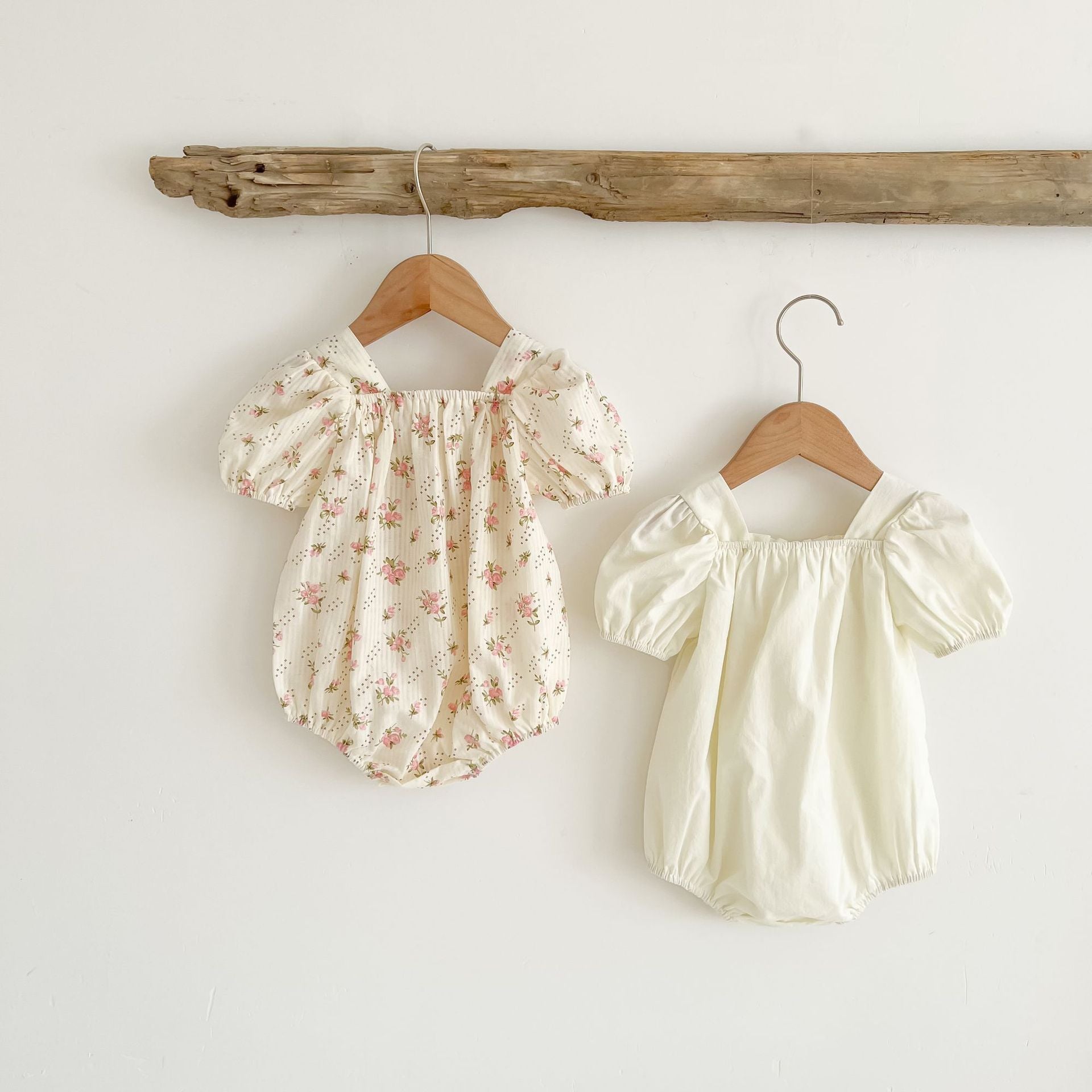 Baby girl onesie featuring a lovely bow-tie design, short sleeves, available in beige and apricot colors.