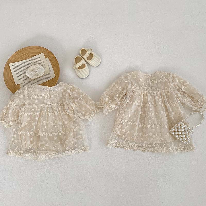 Baby girl mesh patched design square neck onesies dress in beige and apricot colors, featuring floral and embroidered patterns.