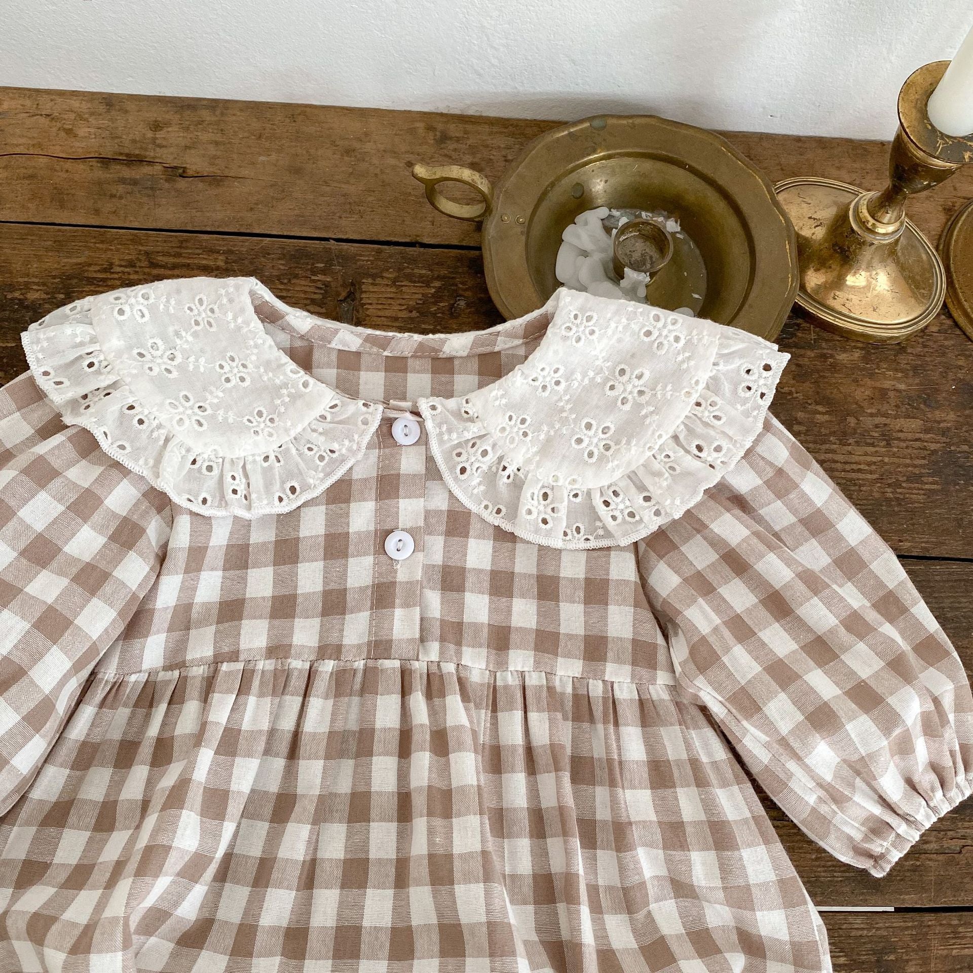 Baby girl plaid graphic lapel design long sleeve onesie in brown, showcasing a stylish and comfortable outfit for infants.