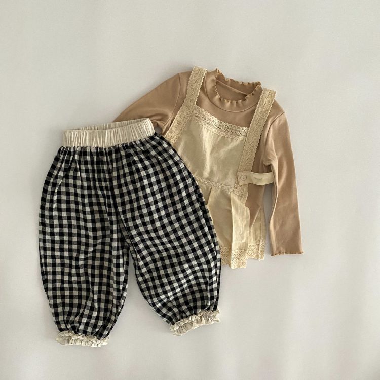 Baby girl long pants featuring a plaid pattern and lace design, perfect for spring and summer wear.