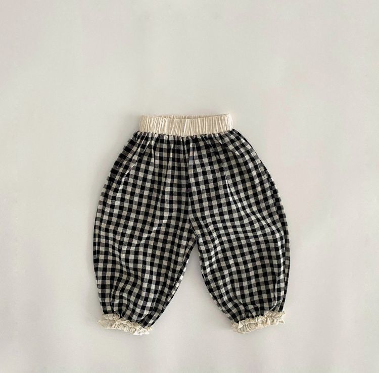 Baby girl long pants featuring a plaid pattern and lace design, perfect for spring and summer wear.