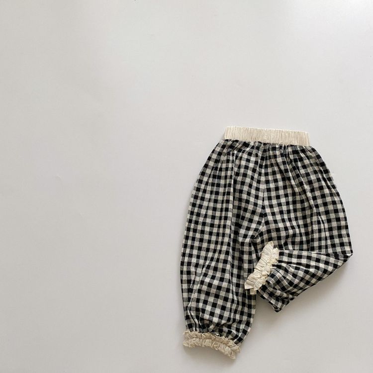 Baby girl long pants featuring a plaid pattern and lace design, perfect for spring and summer wear.