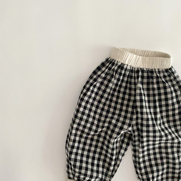 Baby girl long pants featuring a plaid pattern and lace design, perfect for spring and summer wear.